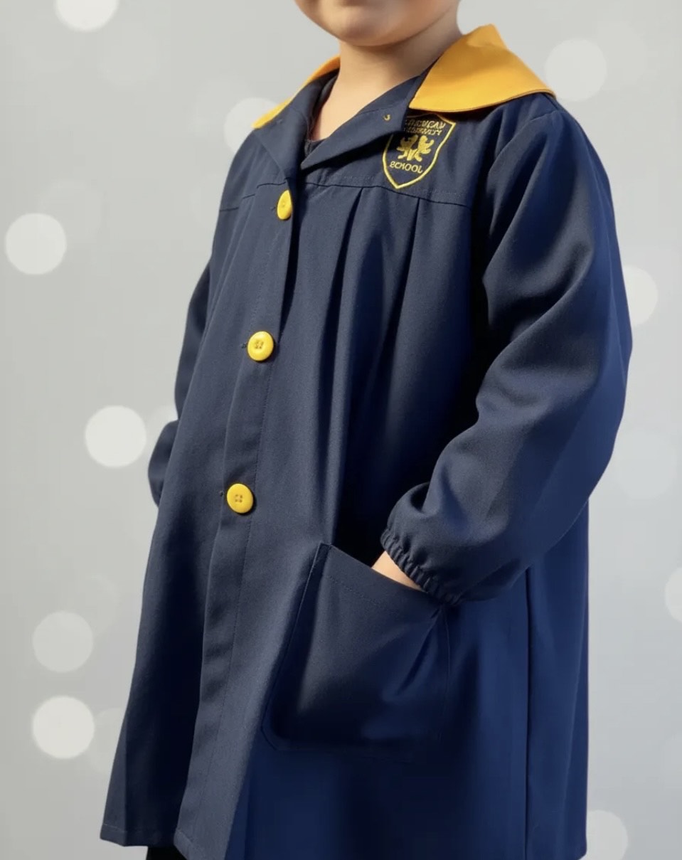 DELANTAL ESCOLAR COLEGIO ROYAL AMERICAN SCHOOL