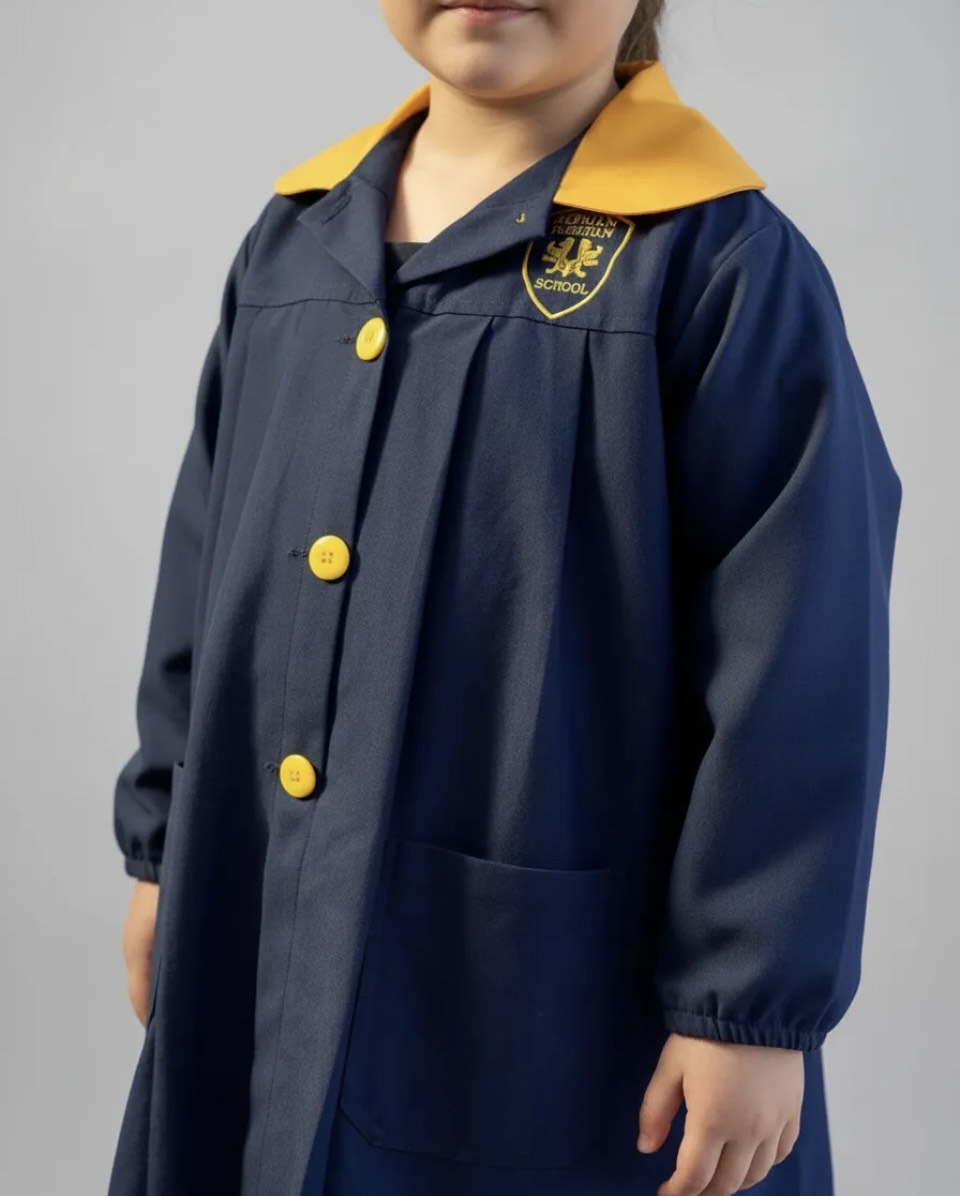 DELANTAL ESCOLAR COLEGIO ROYAL AMERICAN SCHOOL