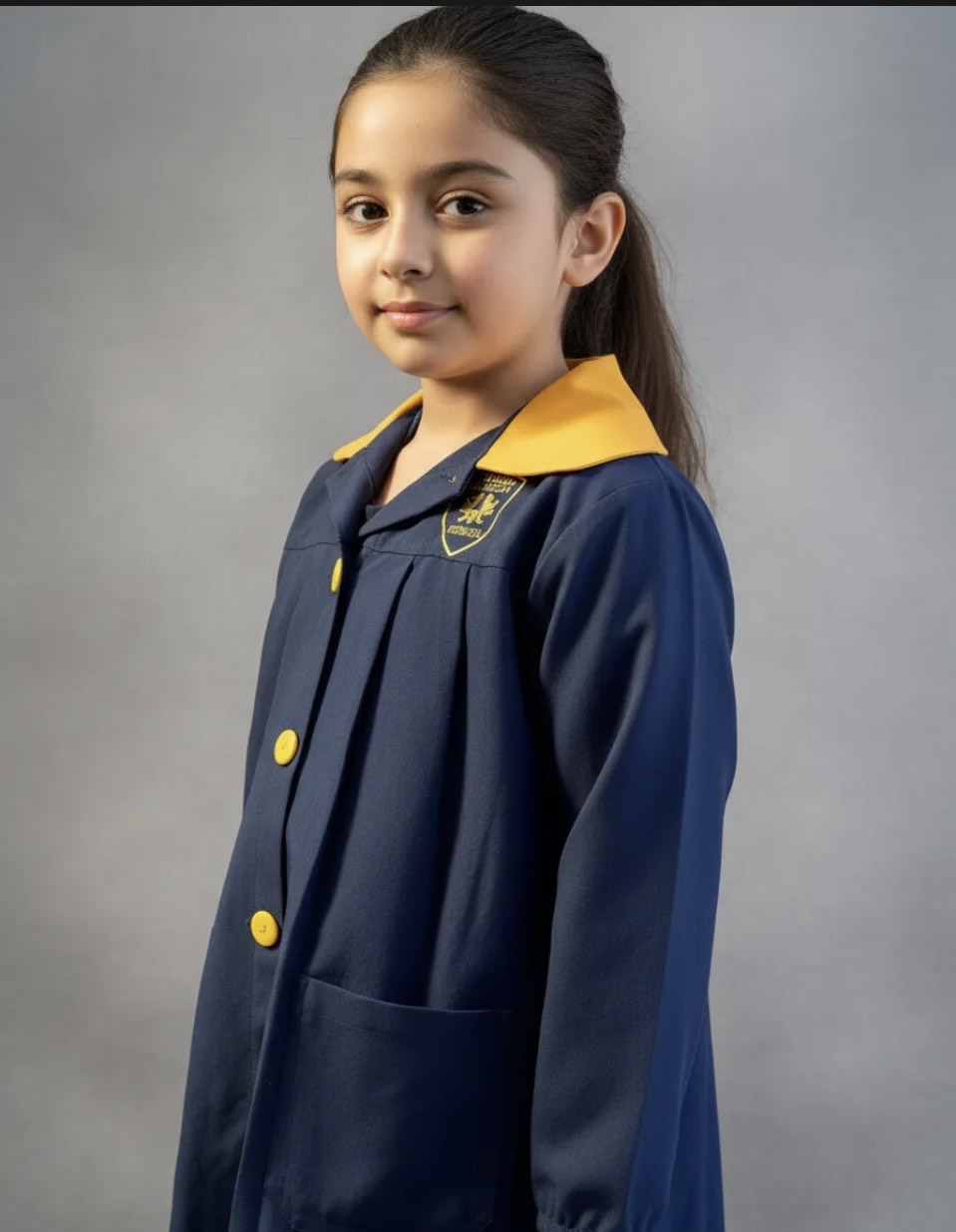 DELANTAL ESCOLAR COLEGIO ROYAL AMERICAN SCHOOL